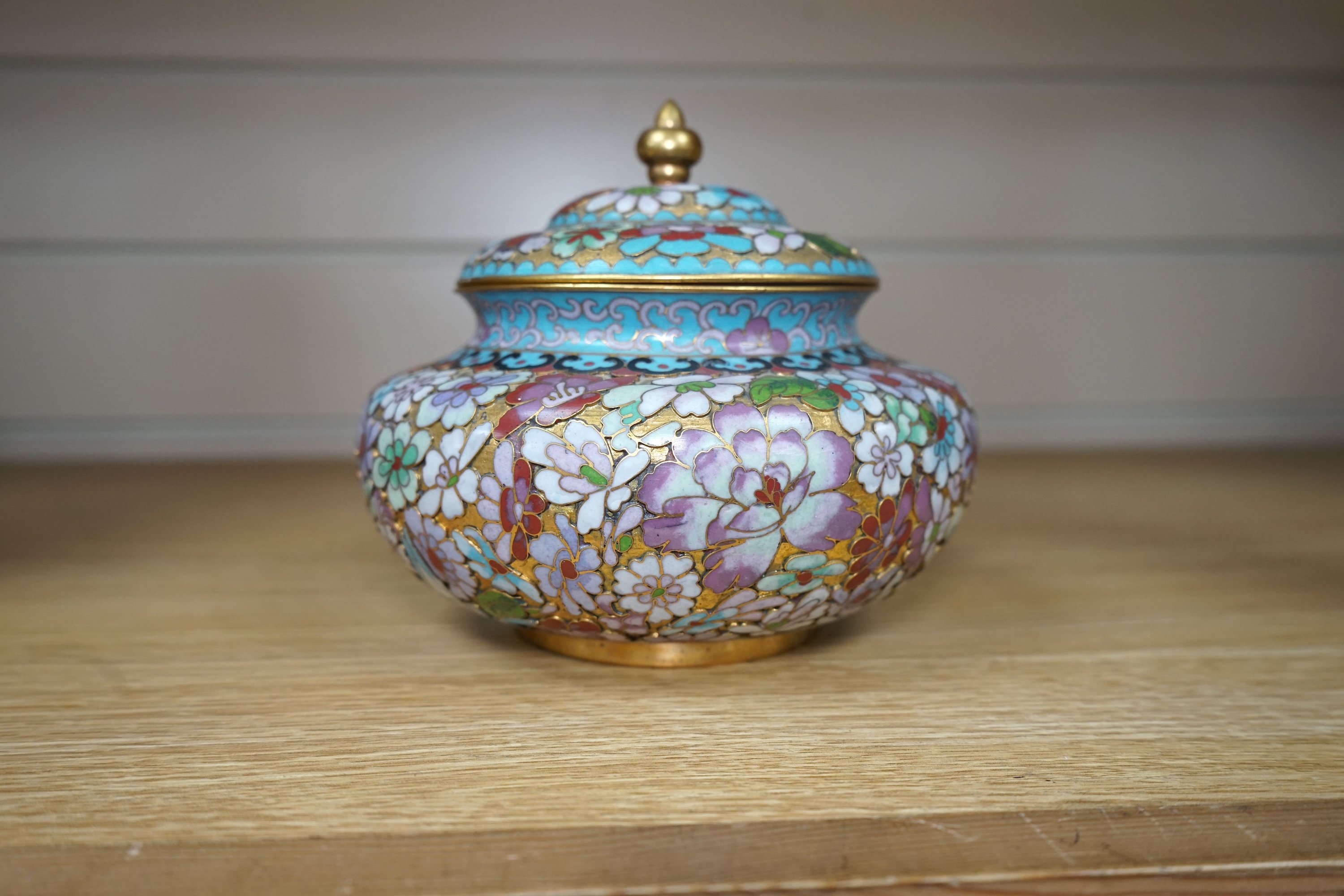 A 20th century Chinese cloisonné enamel pot and cover, 14cm. Condition - good